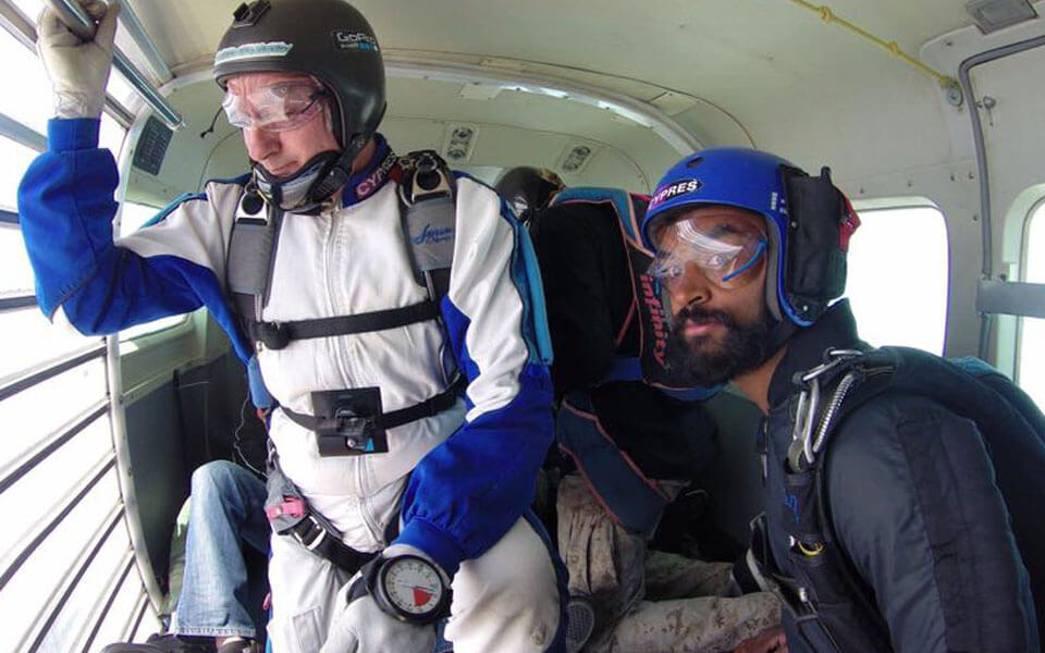Preparing to exit the aircraft on AFF course while learning to skydive.